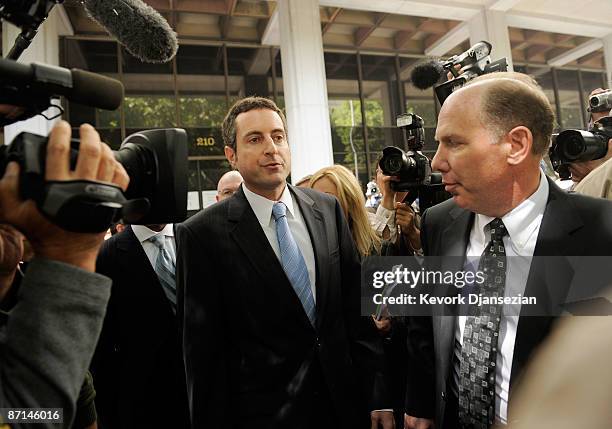 Howard K. Stern, flanked by his lawyers Steven H. Sadow and Krista Barth leaves after getting arraigned at Los Angeles Criminal Courts on May 13,...