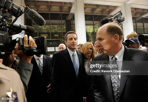 Howard K. Stern, flanked by his lawyers Steven H. Sadow and Krista Barth leaves after getting arraigned at Los Angeles Criminal Courts on May 13,...