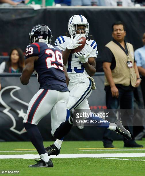 Hilton of the Indianapolis Colts catches pass as Andre Hal of the Houston Texans defends at NRG Stadium on November 5, 2017 in Houston, Texas....
