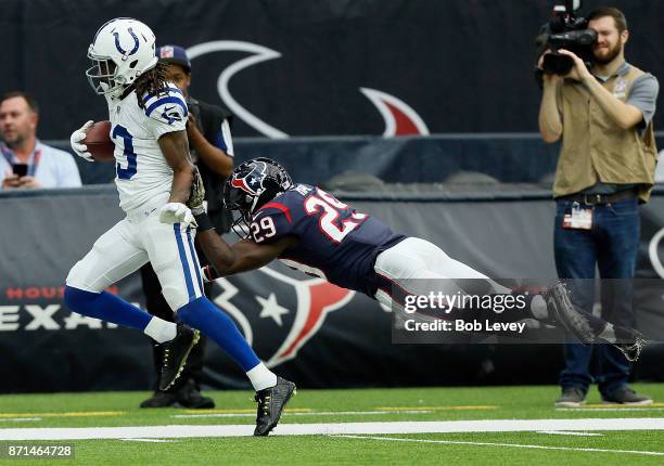 Hilton of the Indianapolis Colts is pushed out of bounds by Andre Hal of the Houston Texans at NRG Stadium on November 5, 2017 in Houston, Texas....