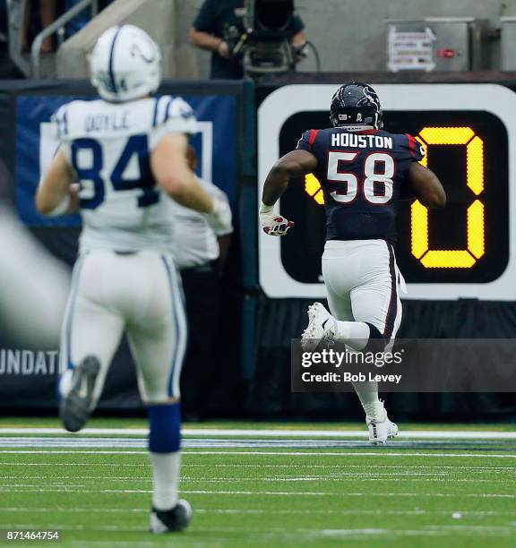 Lamarr Houston of the Houston Texans runs back a fumble for a touchdown against the Indianapolis Colts at NRG Stadium on November 5, 2017 in Houston,...