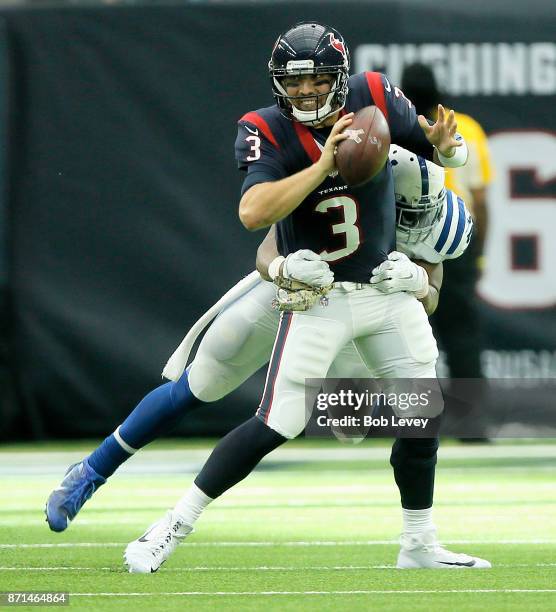 Tom Savage of the Houston Texans is sacked by Jonathan Bostic of the Indianapolis Colts at NRG Stadium on November 5, 2017 in Houston, Texas....