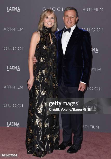 Trustee Willow Bay and Bob Iger arrive at the 2017 LACMA Art + Film Gala at LACMA on November 4, 2017 in Los Angeles, California.