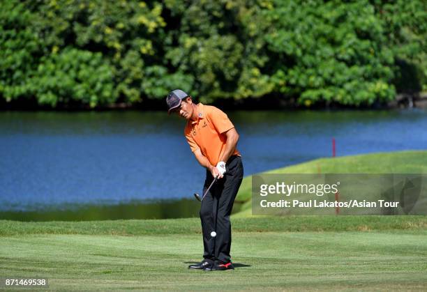 Liang Wenchong of China plays a shot during practice for the Resorts World Manila Masters at Manila Southwoods Golf and Country Club on November 8,...