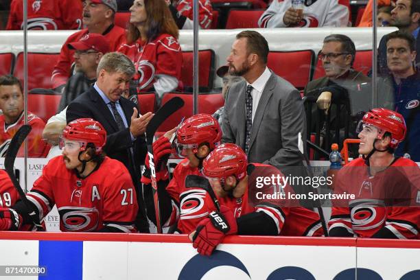 Carolina Hurricanes head coach Bill Peters talks to players on the bench during a game between the Florida Panthers and the Carolina Hurricanes at...