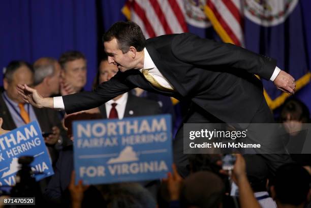 Ralph Northam, the Democratic candidate for governor of Virginia, greets supporters at an election night rally November 7, 2017 in Fairfax, Virginia....