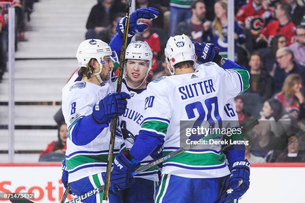 Derek Dorsett of the Vancouver Canucks celebrates with his teammates after scoring against the Calgary Flames during an NHL game at Scotiabank...