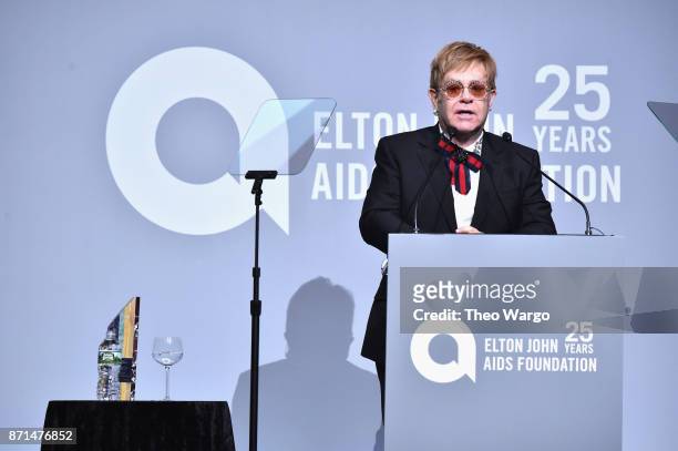 Sir Elton John speaks onstage with the Elizabeth Taylor AIDS Foundation Award at the Elton John AIDS Foundation Commemorates Its 25th Year And Honors...