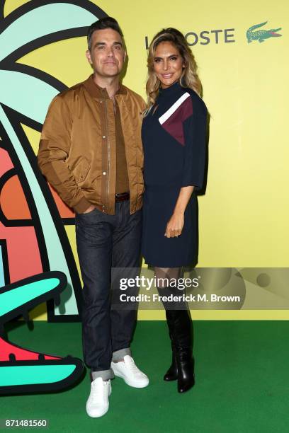 Robbie Williams and Ayda Field Williams attend the celebration of the re-opening of the LACOSTE Rodeo Drive Boutique at Sheats Goldstein Residence on...