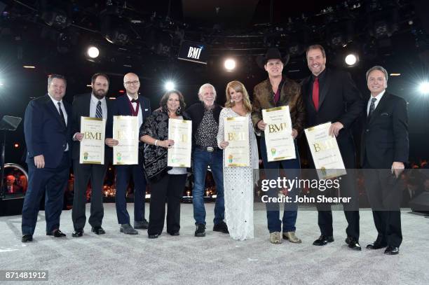 Winners of one of the 50 most performed country songs of the year for "Head Over Boots" pose for a photo onstage during the 65th Annual BMI Country...