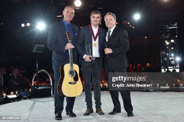 President & CEO Mike O'Neill, songwriter Ross Copperman, BMI Vice President Creative, Nashville Jody Williams pose for a photo onstage during the...