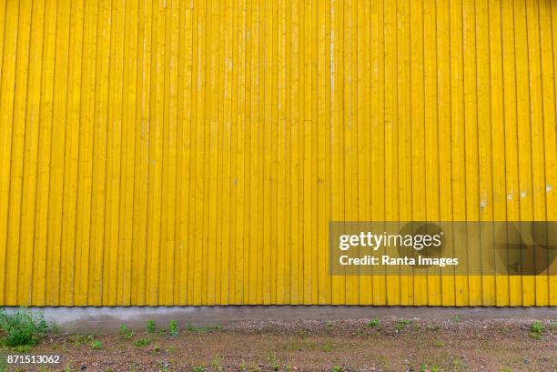 yellow corrugated wall of metal - corrugated stock pictures, royalty-free photos & images