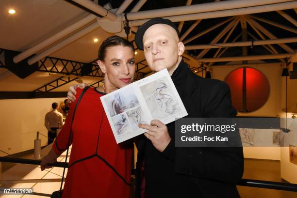 Sacha Lucas and Ali Mahdavi attend the 'Buy Buy Baby' Antoine Kruk Paintings Preview at Atelier Basfroi on November 7, 2017 in Paris, France.