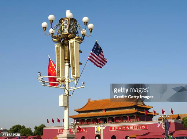 Chinese and American national flags fly on Tian'anmen Square to welcome U.S. President Donald Trump on November 8, 2017 in Beijing, China. U.S....