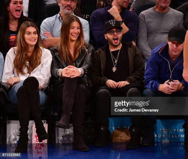 Richie Akiva and guest attend the Charlotte Hornets Vs New York Knicks game at Madison Square Garden on November 7, 2017 in New York City.