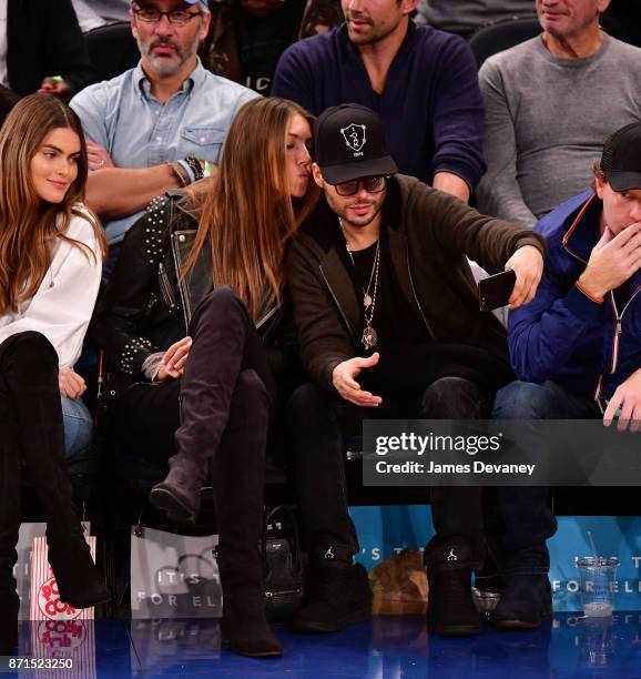 Richie Akiva and guest attend the Charlotte Hornets Vs New York Knicks game at Madison Square Garden on November 7, 2017 in New York City.