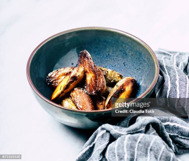 roasted potatoes - fingerling potato stock pictures, royalty-free photos & images