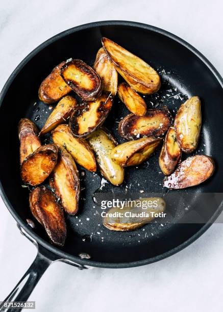 roasted potatoes - fingerling potato stock pictures, royalty-free photos & images