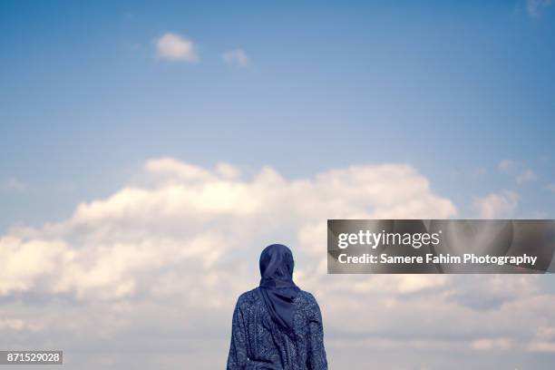 muslim woman - back stock pictures, royalty-free photos & images