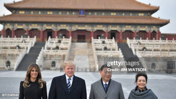 President Donald Trump, First Lady Melania Trump, China's President Xi Jinping and his wife Peng Liyuan pose in the Forbidden City in Beijing on...