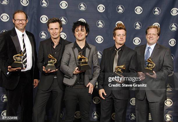 Billie Joe Armstrong, Mike Dirnt, and Tre Cool of Green Day, winners of Record Of The Year for "Boulevard Of Broken Dreams," and guests