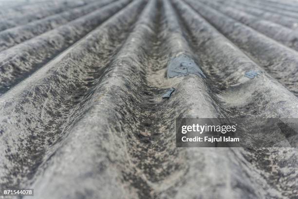 grey waved asbestos roof - asbest bildbanksfoton och bilder