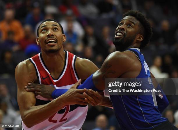 Washington Wizards forward Otto Porter Jr. And Dallas Mavericks guard Wesley Matthews battle under the basket during the game between the Washington...