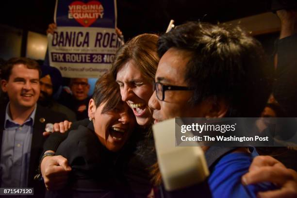 Danica Roem, C, who ran for house of delegates against GOP incumbent Robert Marshall, is greeted by supporters as she prepares to give her victory...