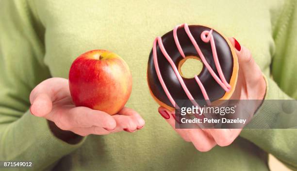 good food bad food - unhealthy living stock pictures, royalty-free photos & images