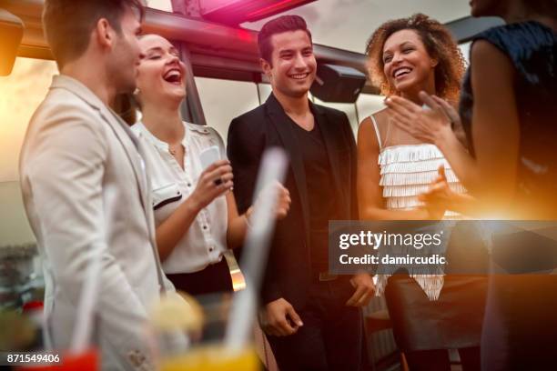 friends having fun in nightclub - cocktail counter stock pictures, royalty-free photos & images