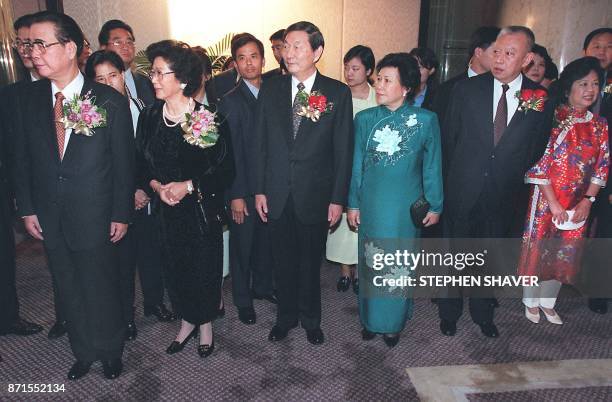 Chinese Premier Li Peng, along with his wife Zhu Lin, Zhu Rongji and his wife Lao An, and Tung Chee-hwa with his wife Betty, wait to greet 22...