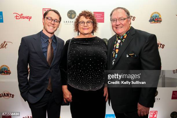 Sam, Nancy, and John Lasseter pose for photos on the red carpet during The Walt Disney Family Museum's 3rd Annual Fundraising Gala at the Golden Gate...