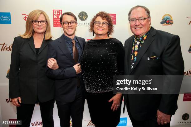 Bonnie Hunt and Sam, Nancy, and John Lasseter pose for photos on the red carpet during The Walt Disney Family Museum's 3rd Annual Fundraising Gala at...