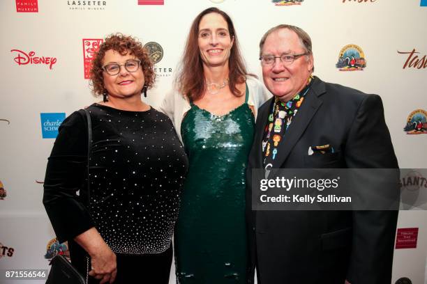 Nancy Lasseter, Kirsten Komoroske, and John Lasseter pose for photos on the red carpet during The Walt Disney Family Museum's 3rd Annual Fundraising...