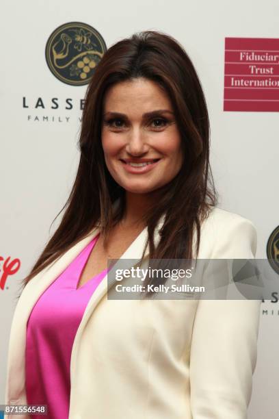 Idina Menzel poses for photos on the red carpet during The Walt Disney Family Museum's 3rd Annual Fundraising Gala at the Golden Gate Club on...