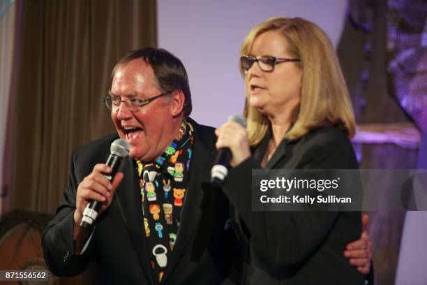 John Lasseter and Bonnie Hunt speak onstage during The Walt Disney Family Museum's 3rd Annual Fundraising Gala at the Golden Gate Club on November 7,...