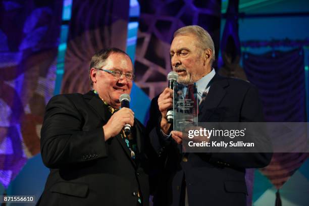 John Lasseter receives the Diane Disney Miller Lifetime Achievement Award from Ron Miller, President of the Board of The Walt Disney Family Museum,...