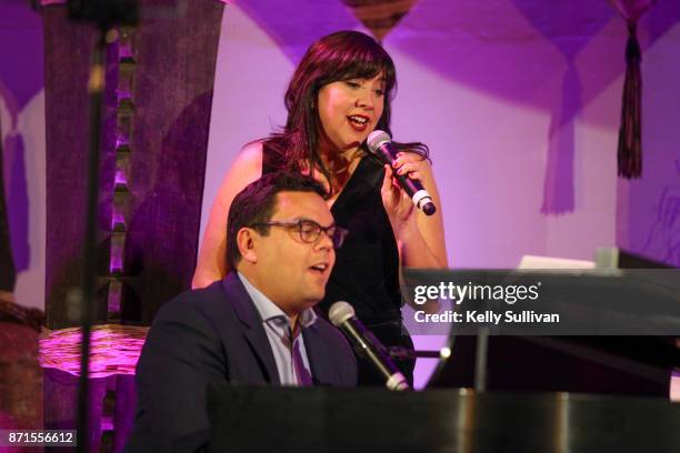 Kristen Anderson-Lopez and Bobby Lopez perform onstage during The Walt Disney Family Museum's 3rd Annual Fundraising Gala at the Golden Gate Club on...