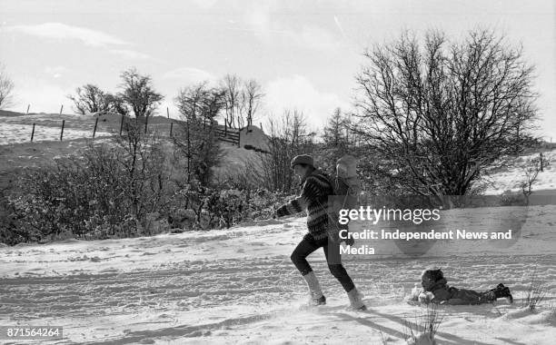 Val Stanley and her son, Aengus Stanley , gives a sleigh ride to Helen Feeney , circa January 1988. .