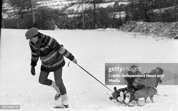 Val Stanley and her son, Aengus Stanley , gives a sleigh ride to Helen Feeney , circa January 1988. .