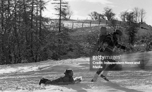 Val Stanley and her son, Aengus Stanley , gives a sleigh ride to Helen Feeney , circa January 1988. .