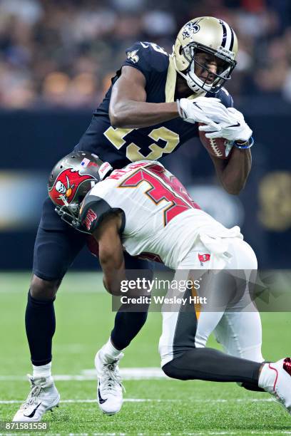 Michael Thomas of the New Orleans Saints is tackled by Robert McClain of the Tampa Bay Buccaneers at Mercedes-Benz Superdome on November 5, 2017 in...