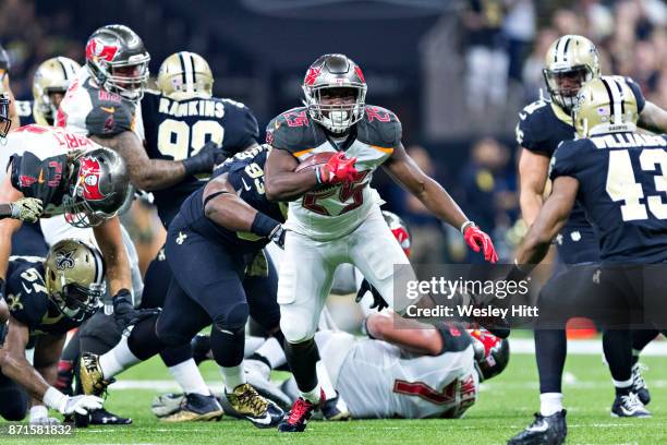 Peyton Barber of the Tampa Bay Buccaneers runs the ball during a game against the New Orleans Saints at Mercedes-Benz Superdome on November 5, 2017...