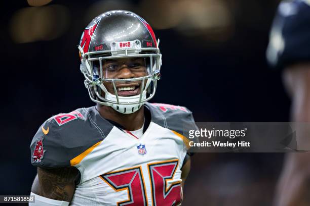 Robert McClain of the Tampa Bay Buccaneers is all smiles on the field during a game against the New Orleans Saints at Mercedes-Benz Superdome on...