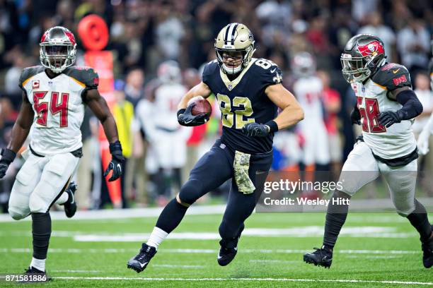 Coby Fleener of the New Orleans Saints and is tackled by Kwon Alexander of the Tampa Bay Buccaneers at Mercedes-Benz Superdome on November 5, 2017 in...