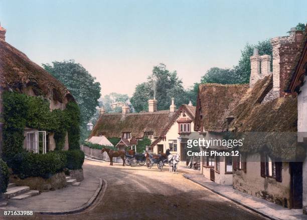 Thatched houses and horse drawn carriages in Shanklin, old village, Isle of Wight, England 1890.