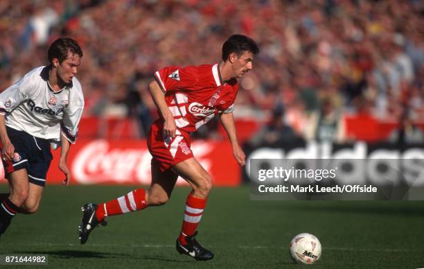 April 1995 Wembley: Football League Cup Final : Bolton Wanderers v Liverpool FC: Ian Rush of Liverpool is pursued by Jason McAteer of Bolton