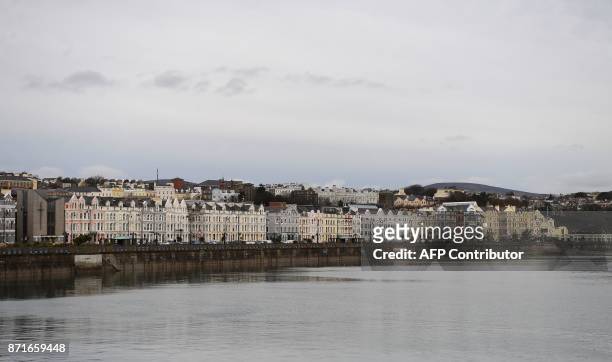 Seafront properties line the coastal road in Douglas on the Isle of Man, an island in the Irish Sea off of the west coast England, on November 8,...