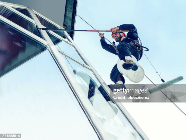 window washer - abseiling stock pictures, royalty-free photos & images