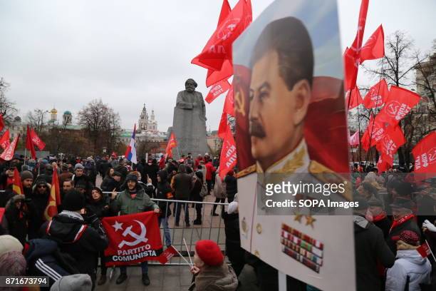 Stalin's portrait seen during the march. Thousands marched to Revolution Square in central Moscow to commemorate the 100th anniversary of the Russian...